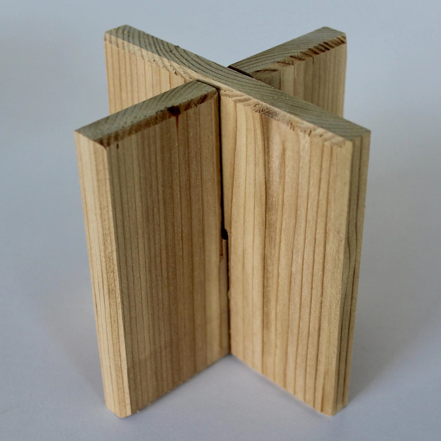 LB X-Configuration: A 4-inch accent scale interlocking red cedar plant stand. This tectonic anchor by SBW Studio serves as a geometric timber foundation for small vessels and organic flora.